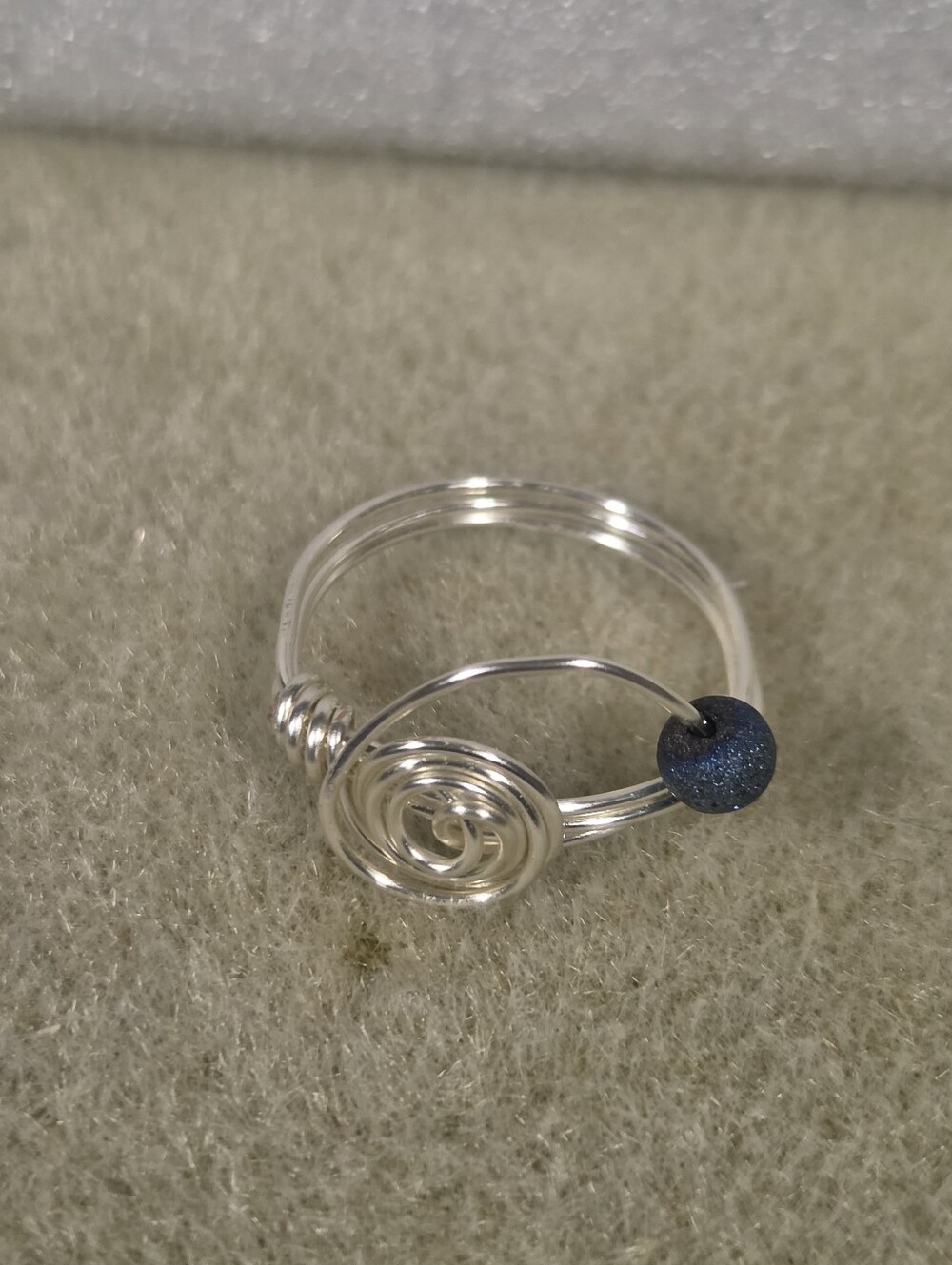 Handcrafted Silver Wire Spiral Fidget Ring with Dark Blue Bead